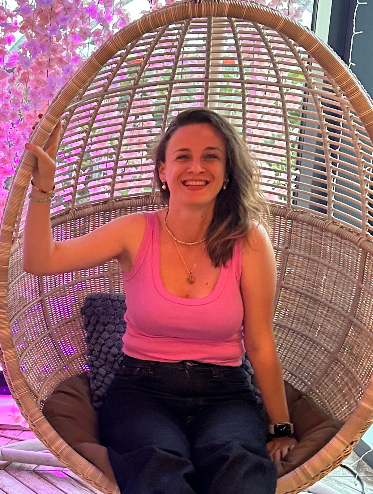 woman smiling in swinging chair